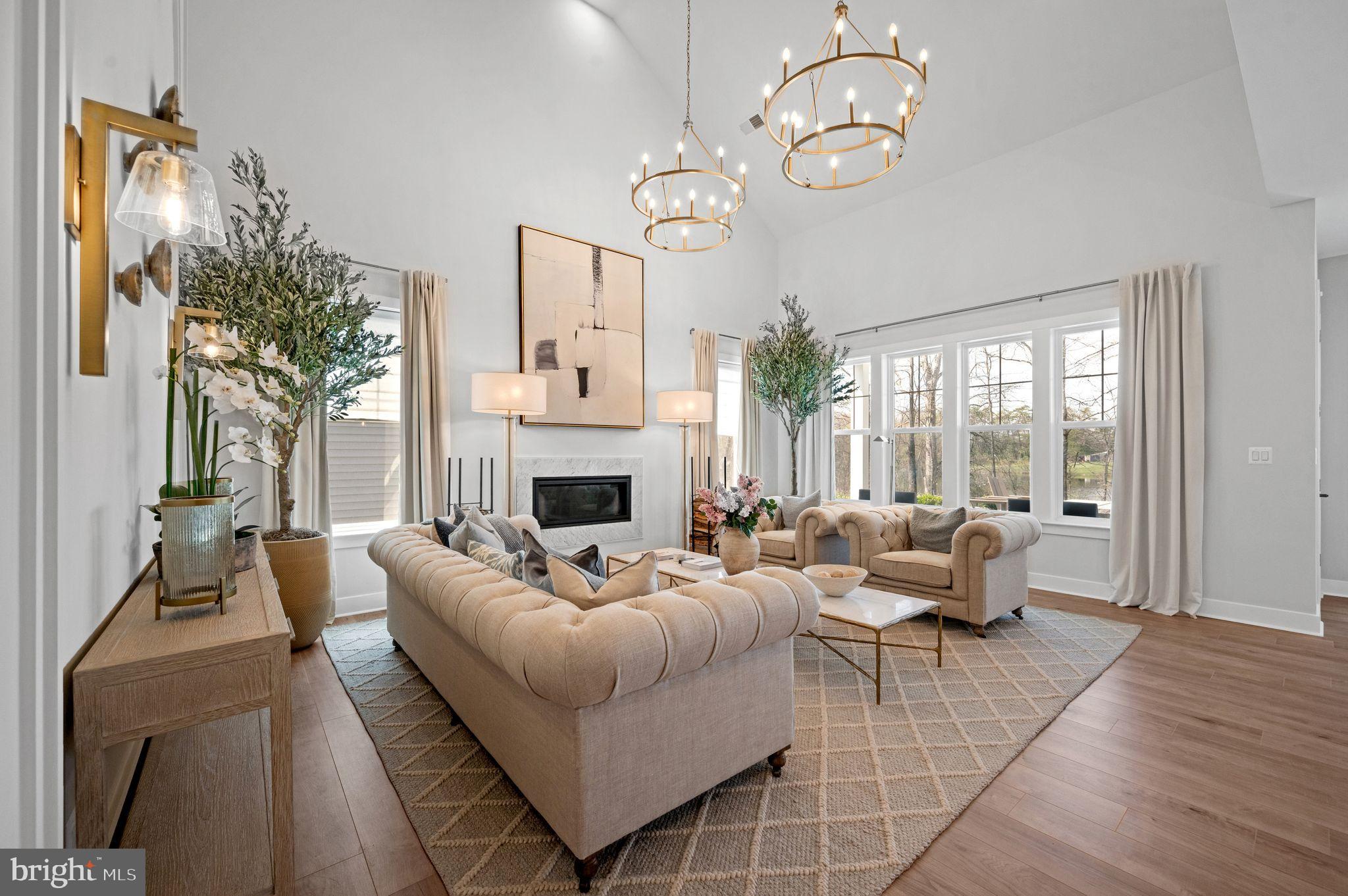 Tbd New Vista Way, Unit 5 Gettysburg, PA 17325 - Photo 13 of 45 a living room with furniture a fireplace and a chandelier
