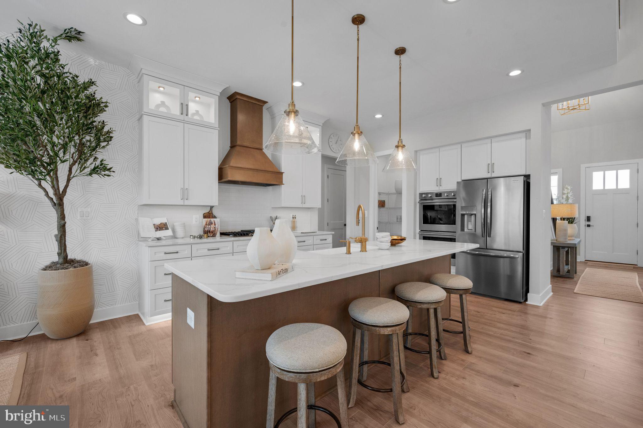 Tbd New Vista Way, Unit 5 Gettysburg, PA 17325 - Photo 16 of 45 a kitchen with stainless steel appliances granite countertop a sink a stove a refrigerator and chairs