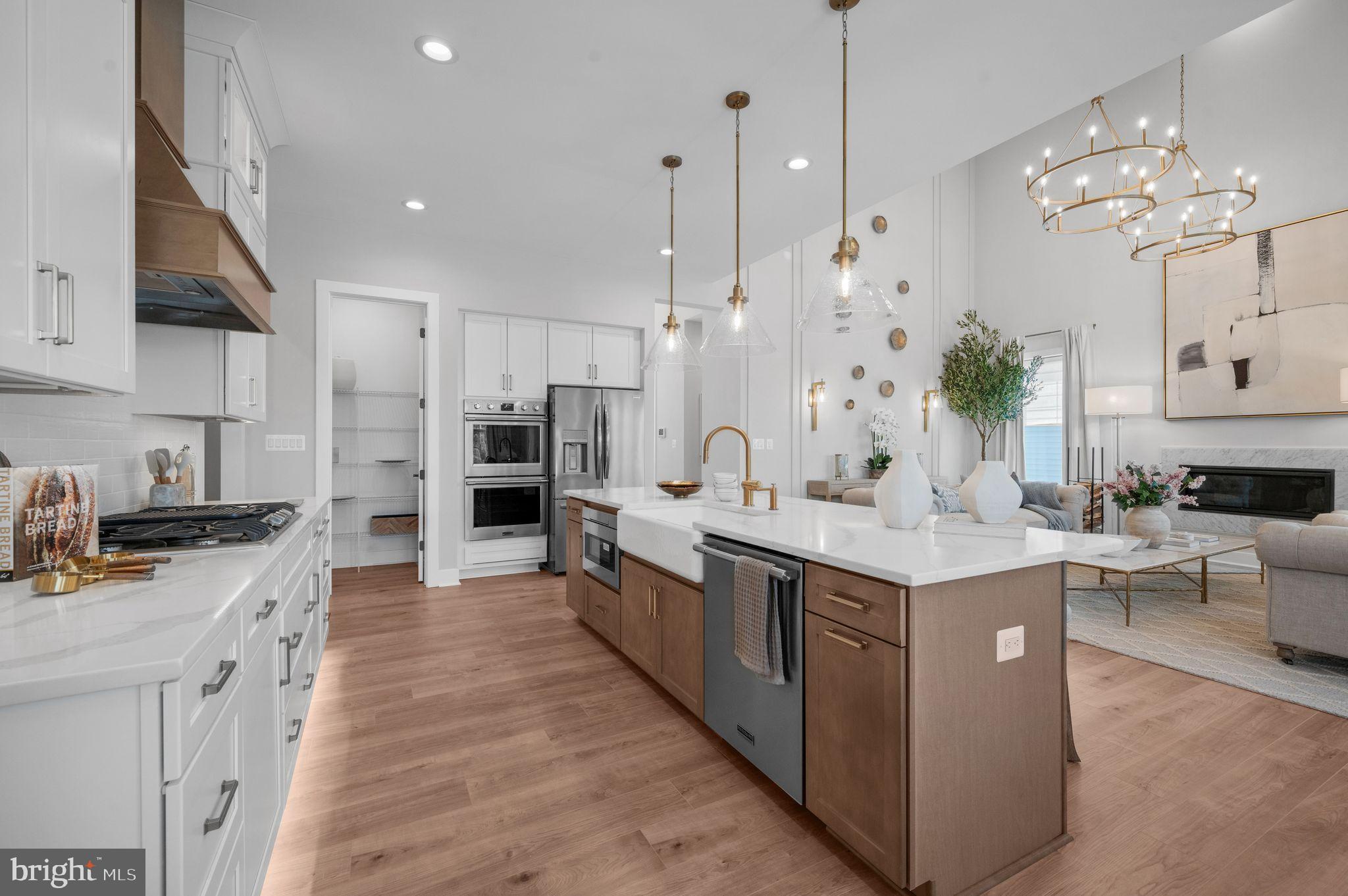 Tbd New Vista Way, Unit 5 Gettysburg, PA 17325 - Photo 19 of 45 a large kitchen with kitchen island a sink a counter top space stainless steel appliances and cabinets