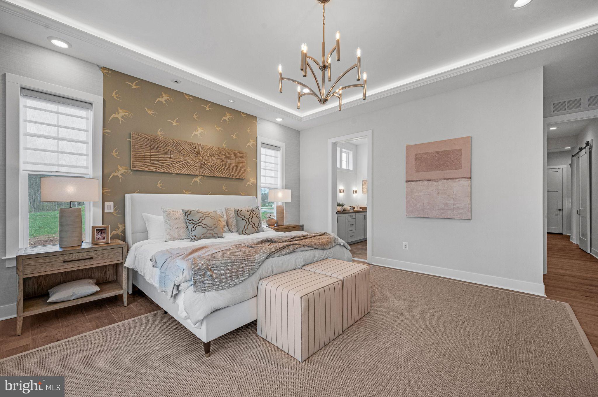 Tbd New Vista Way, Unit 5 Gettysburg, PA 17325 - Photo 24 of 45 a spacious bedroom with a bed and a chandelier