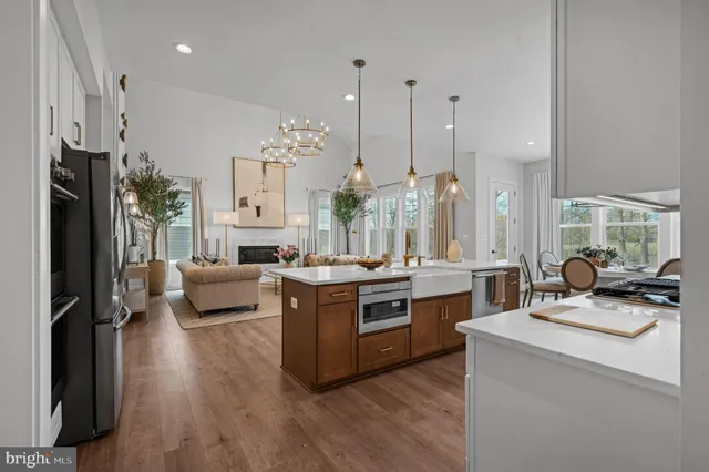 a kitchen with a sink stove and refrigerator