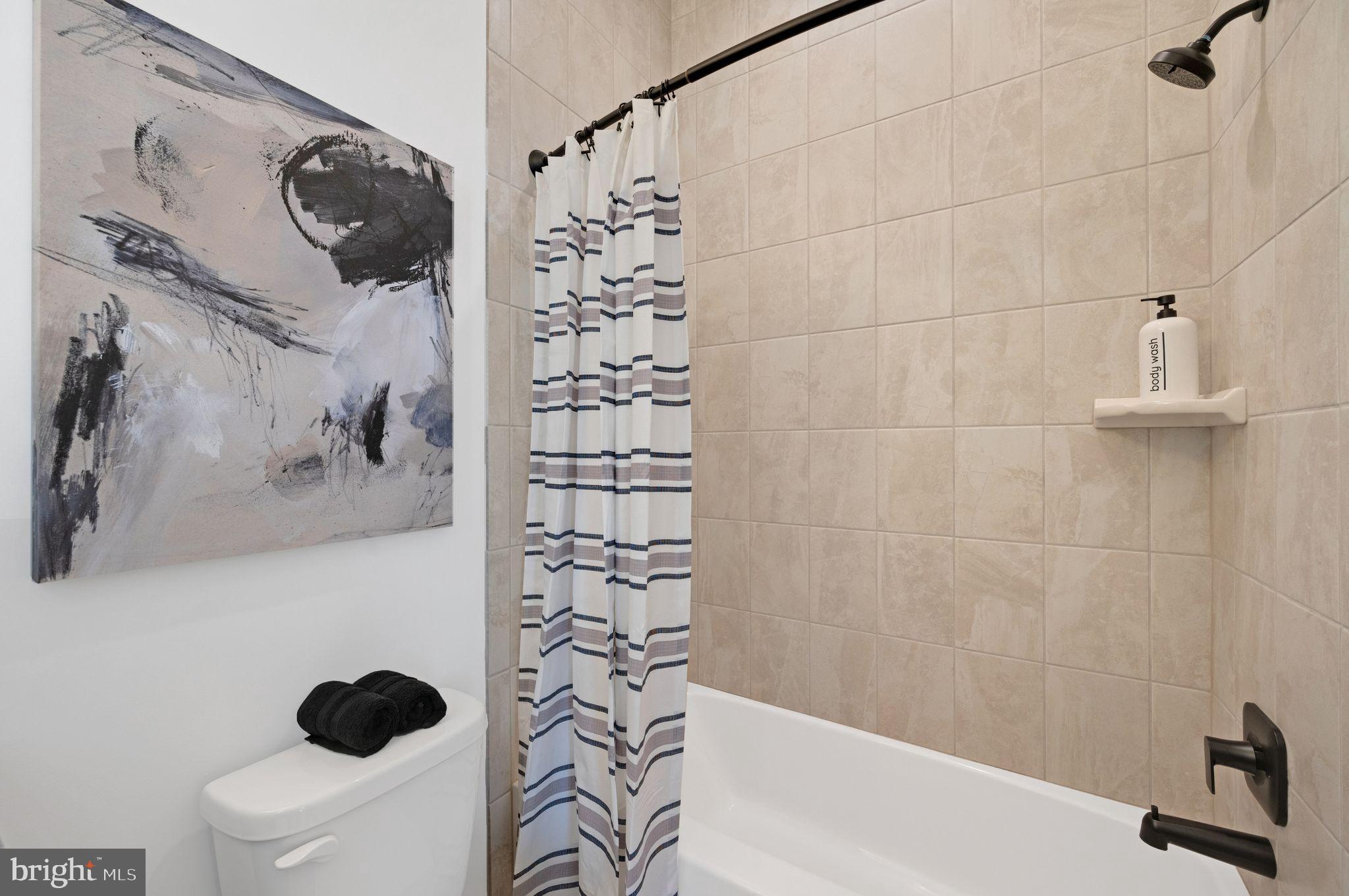 Tbd New Vista Way, Unit 5 Gettysburg, PA 17325 - Photo 30 of 45 a bathroom with a shower a toilet and a shower curtain