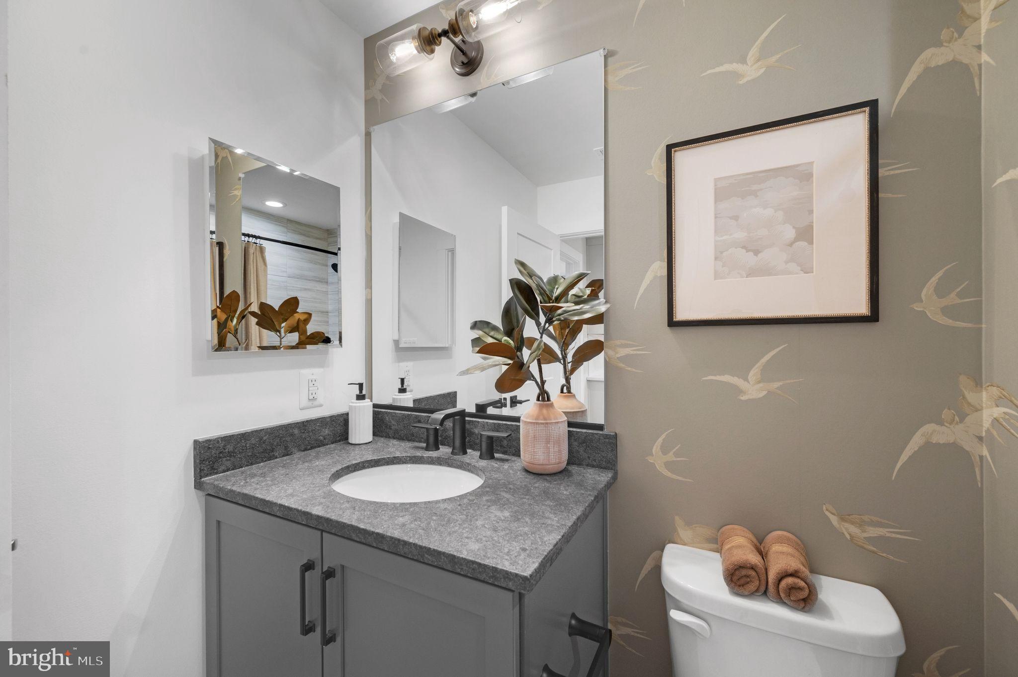 Tbd New Vista Way, Unit 5 Gettysburg, PA 17325 - Photo 34 of 45 a bathroom with a granite countertop sink a mirror and a toilet