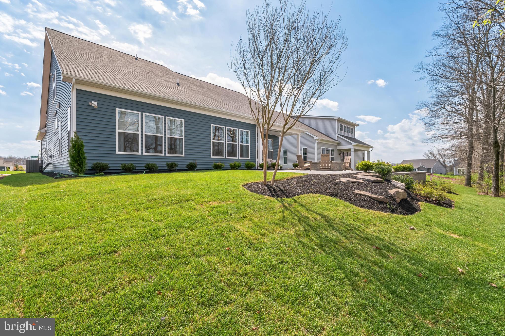 Tbd New Vista Way, Unit 5 Gettysburg, PA 17325 - Photo 7 of 45 a view of a yard in front of a brick house with a large tree