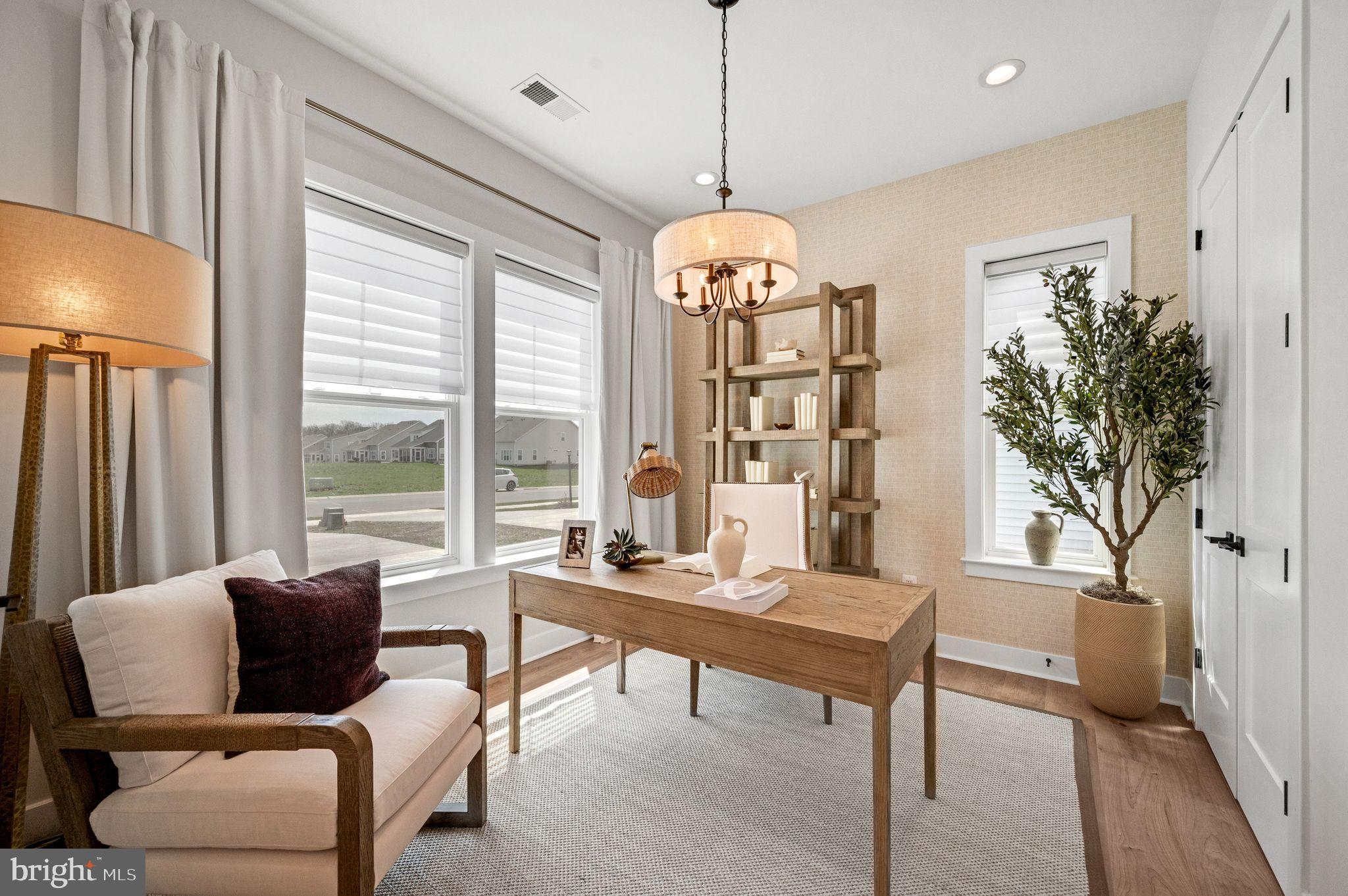 Tbd New Vista Way, Unit 5 Gettysburg, PA 17325 - Photo 8 of 45 a living room with furniture and a chandelier