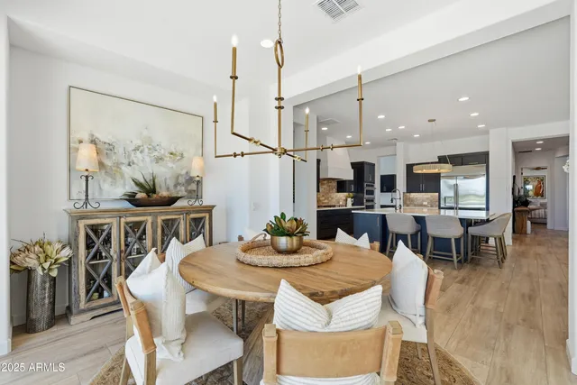 a view of a livingroom with workspace and a window