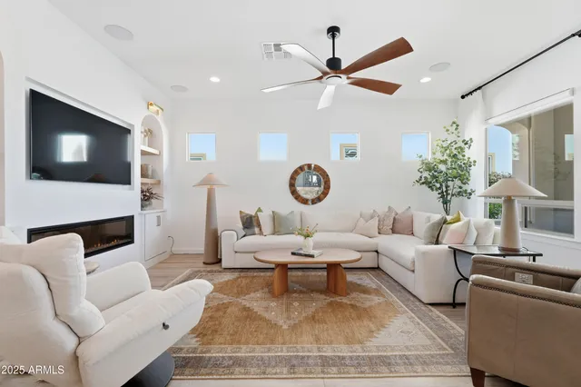 a bed room with a bed and a chandelier