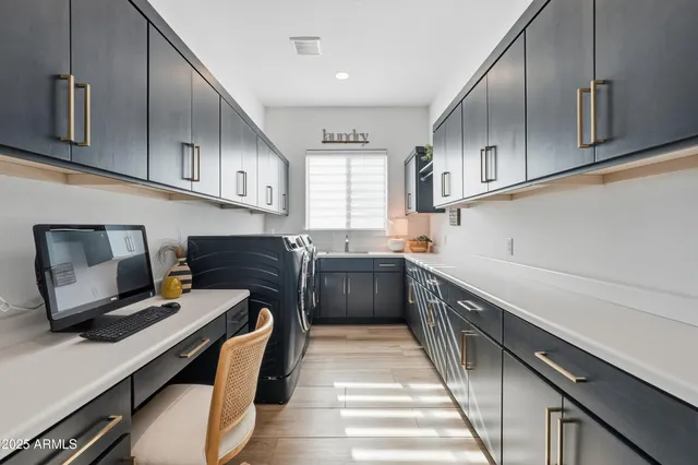 a spacious bathroom with a granite countertop sink a toilet a mirror and vanity