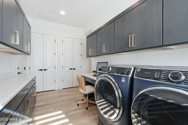 a spacious bathroom with a granite countertop sink a toilet a mirror and shower