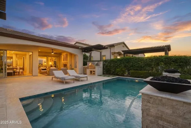 an aerial view of a house with garden space and ocean view