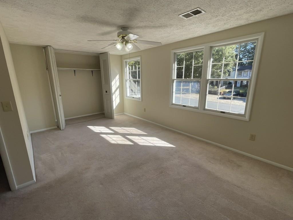 110 Roswell Commons Way Roswell, GA 30076 - Photo 12 of 26 an empty room with windows