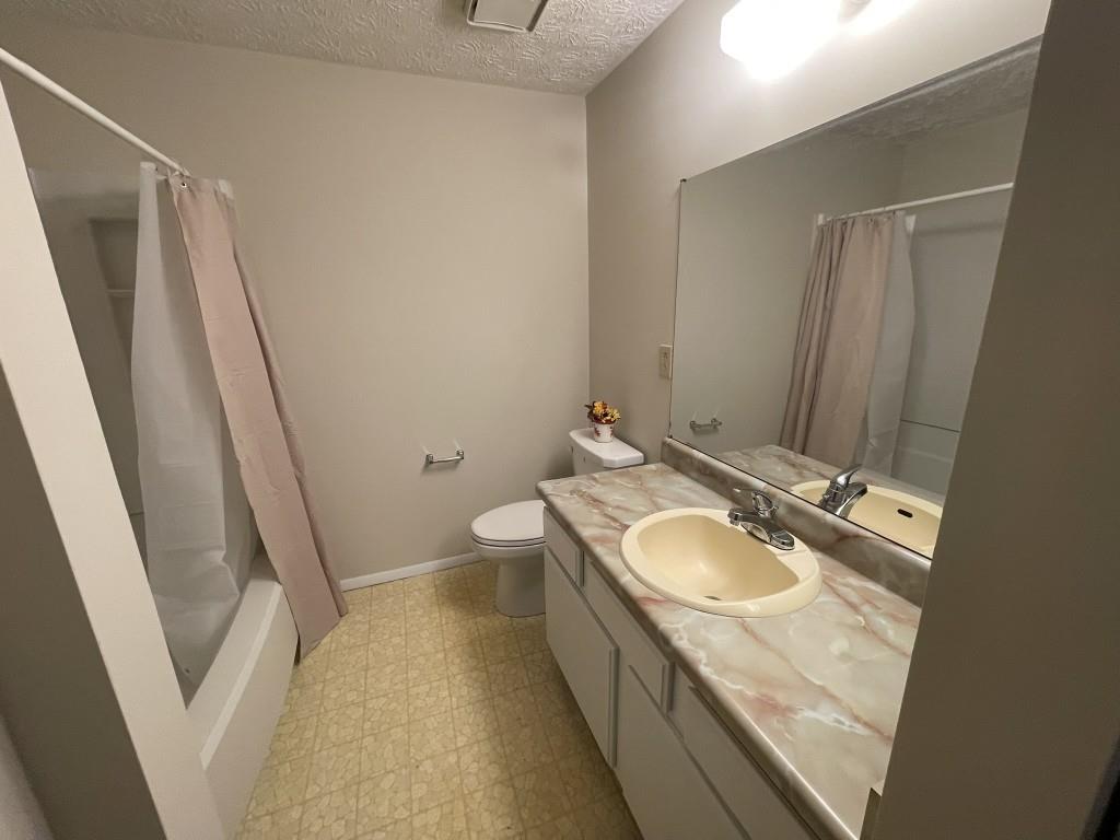 110 Roswell Commons Way Roswell, GA 30076 - Photo 15 of 26 a bathroom with a granite countertop sink and a mirror