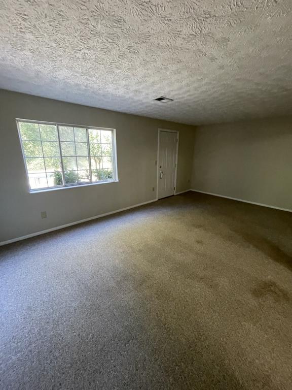 110 Roswell Commons Way Roswell, GA 30076 - Photo 18 of 26 an empty room with windows