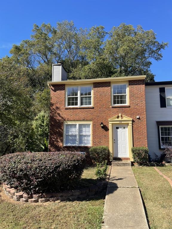 110 Roswell Commons Way Roswell, GA 30076 - Photo 2 of 26 a front view of a house with a yard