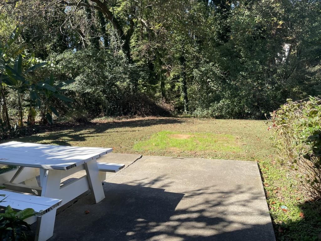 110 Roswell Commons Way Roswell, GA 30076 - Photo 21 of 26 a view of a swimming pool with an outdoor space and seating area
