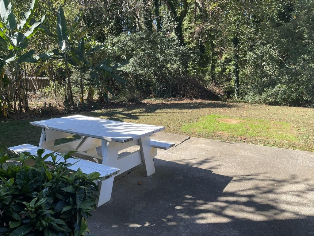 110 Roswell Commons Way Roswell, GA 30076 - Photo 22 of 26 a view of a swimming pool with an outdoor space and seating area