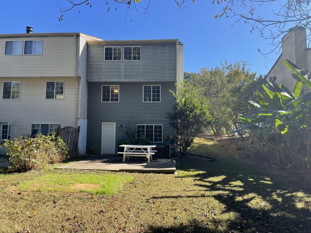 110 Roswell Commons Way Roswell, GA 30076 - Photo 23 of 26 a front view of a house with a yard