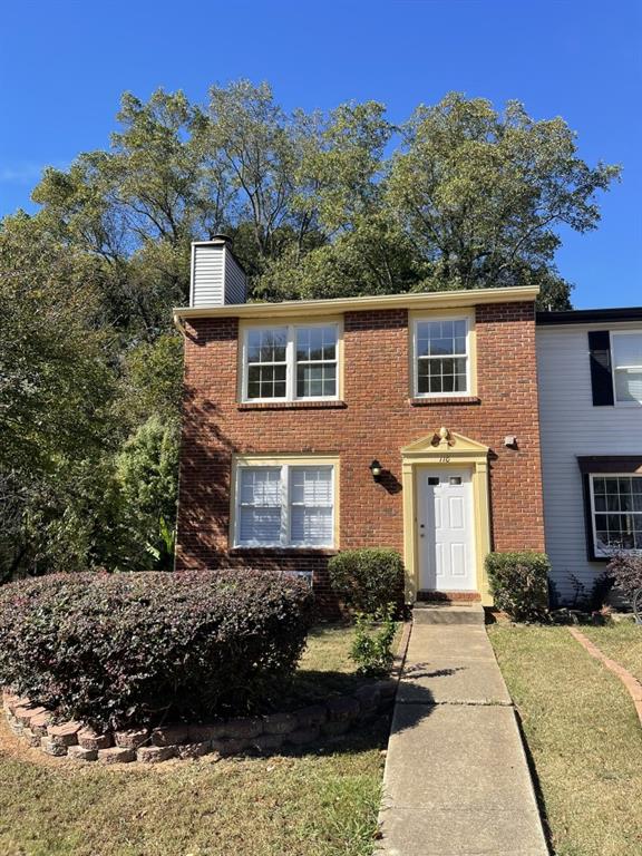 110 Roswell Commons Way Roswell, GA 30076 - Photo 26 of 26 a front view of a house with a yard