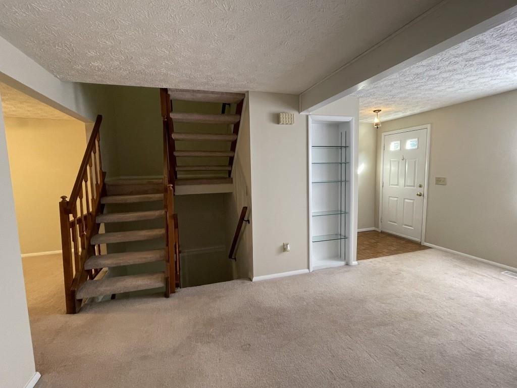 110 Roswell Commons Way Roswell, GA 30076 - Photo 8 of 26 a view of an empty room with a fireplace