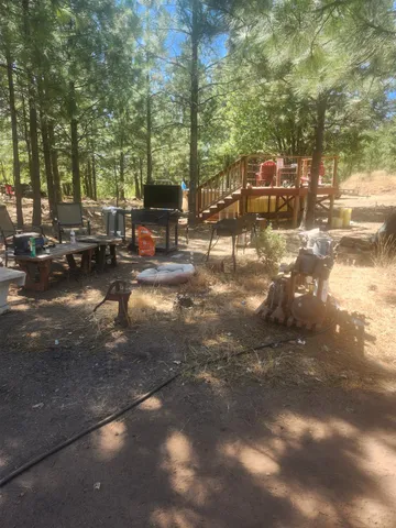 a view of a street with cars parked