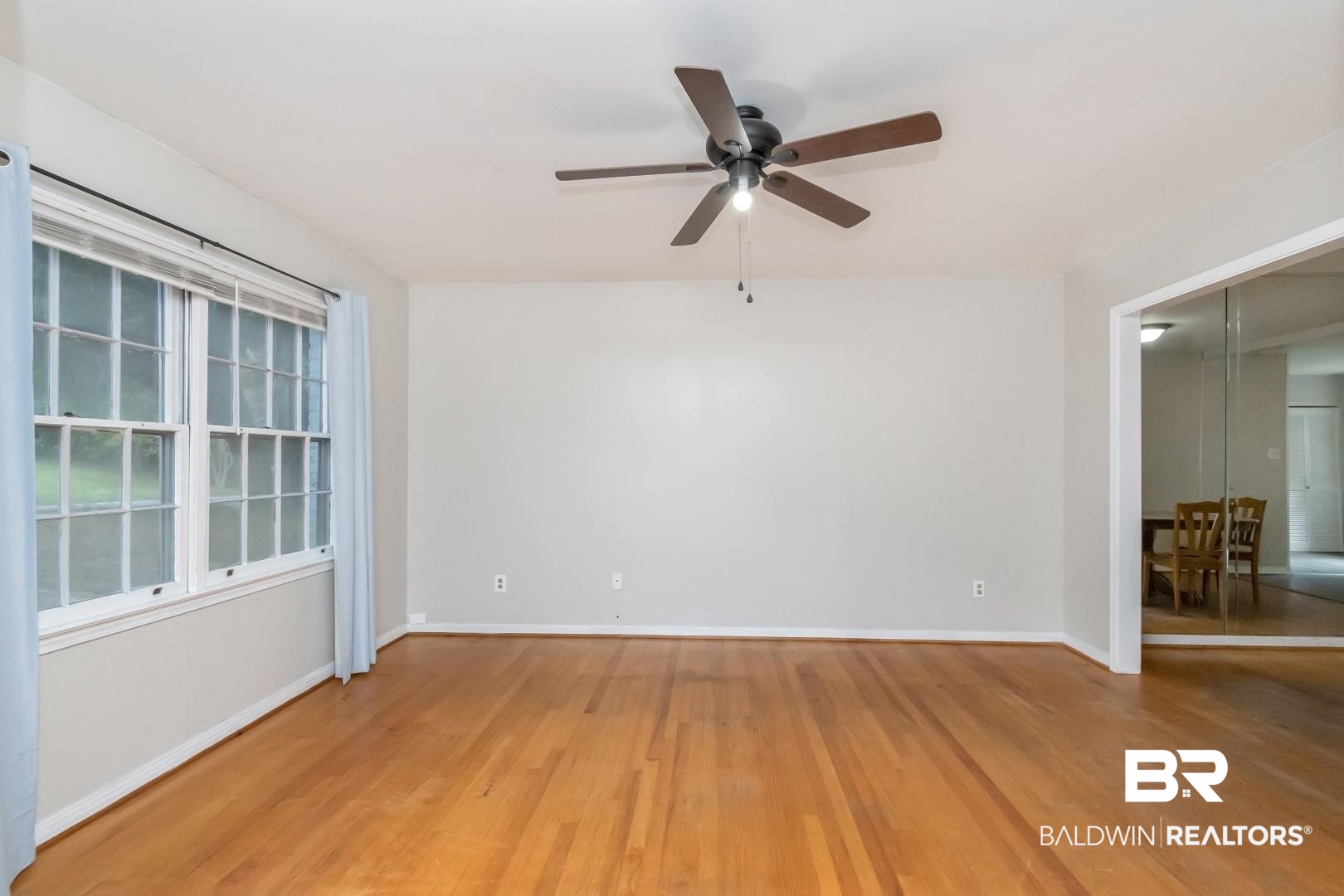 320 Vanderbilt Drive Mobile, AL 36608 - Photo 6 of 39 Empty room featuring ceiling fan and hardwood / wood-style flooring