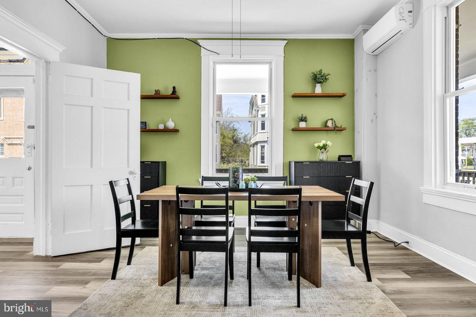 406 High Street Cambridge, MD 21613 - Photo 1 of 24 a view of a dining room with furniture and window