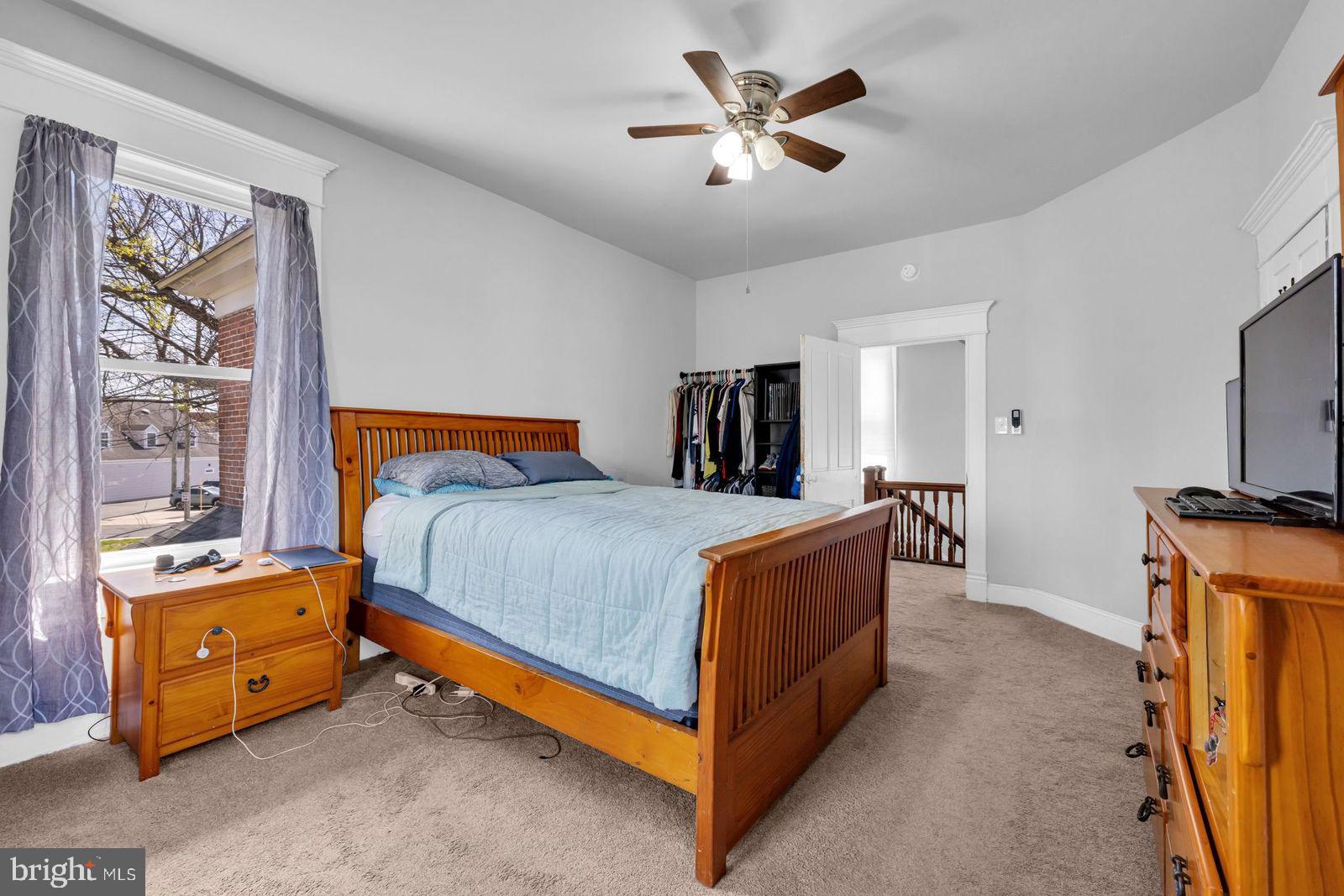 406 High Street Cambridge, MD 21613 - Photo 12 of 24 a bed room with a bed and a tv