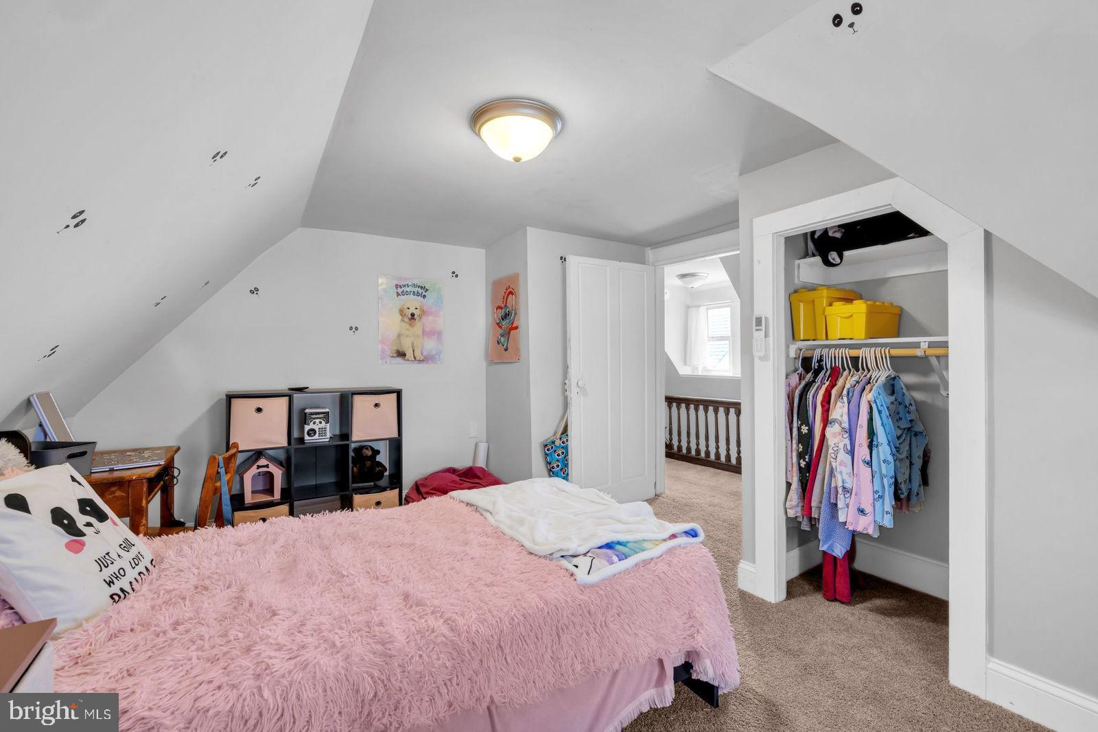 406 High Street Cambridge, MD 21613 - Photo 14 of 24 a bed room with a bed and a lamp