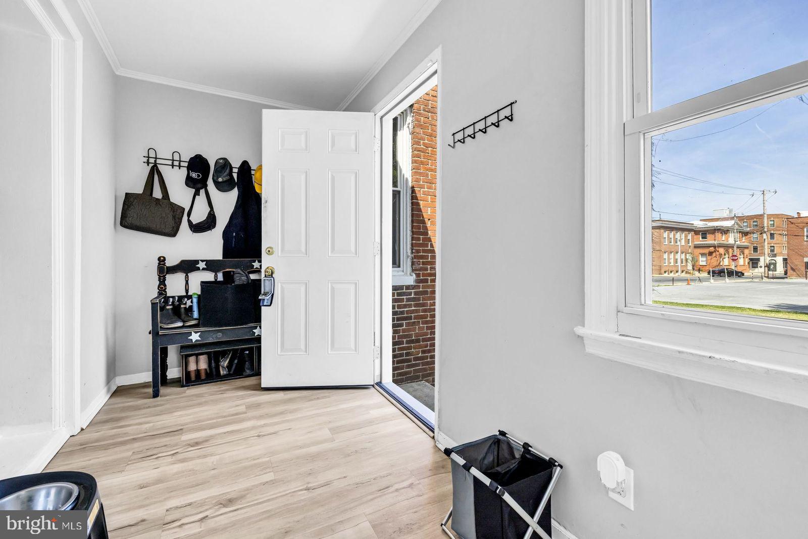 406 High Street Cambridge, MD 21613 - Photo 2 of 24 a view of a room with gym equipment and wooden floor