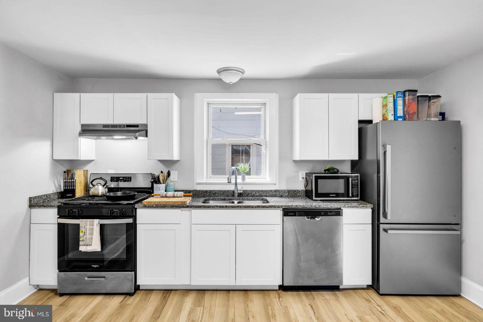 406 High Street Cambridge, MD 21613 - Photo 4 of 24 a kitchen with appliances a sink and cabinets