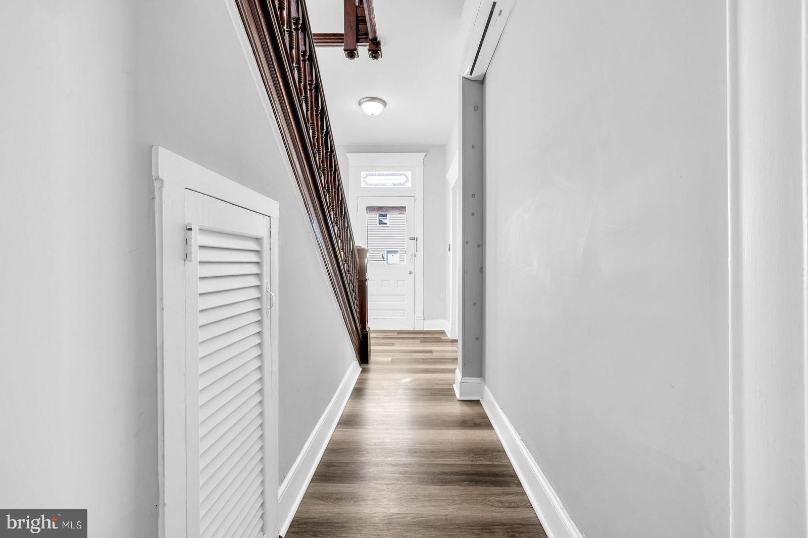 406 High Street Cambridge, MD 21613 - Photo 9 of 24 a view of a hallway with wooden floor