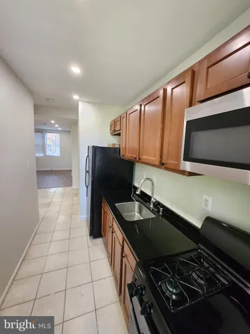 a kitchen with a stove and a microwave