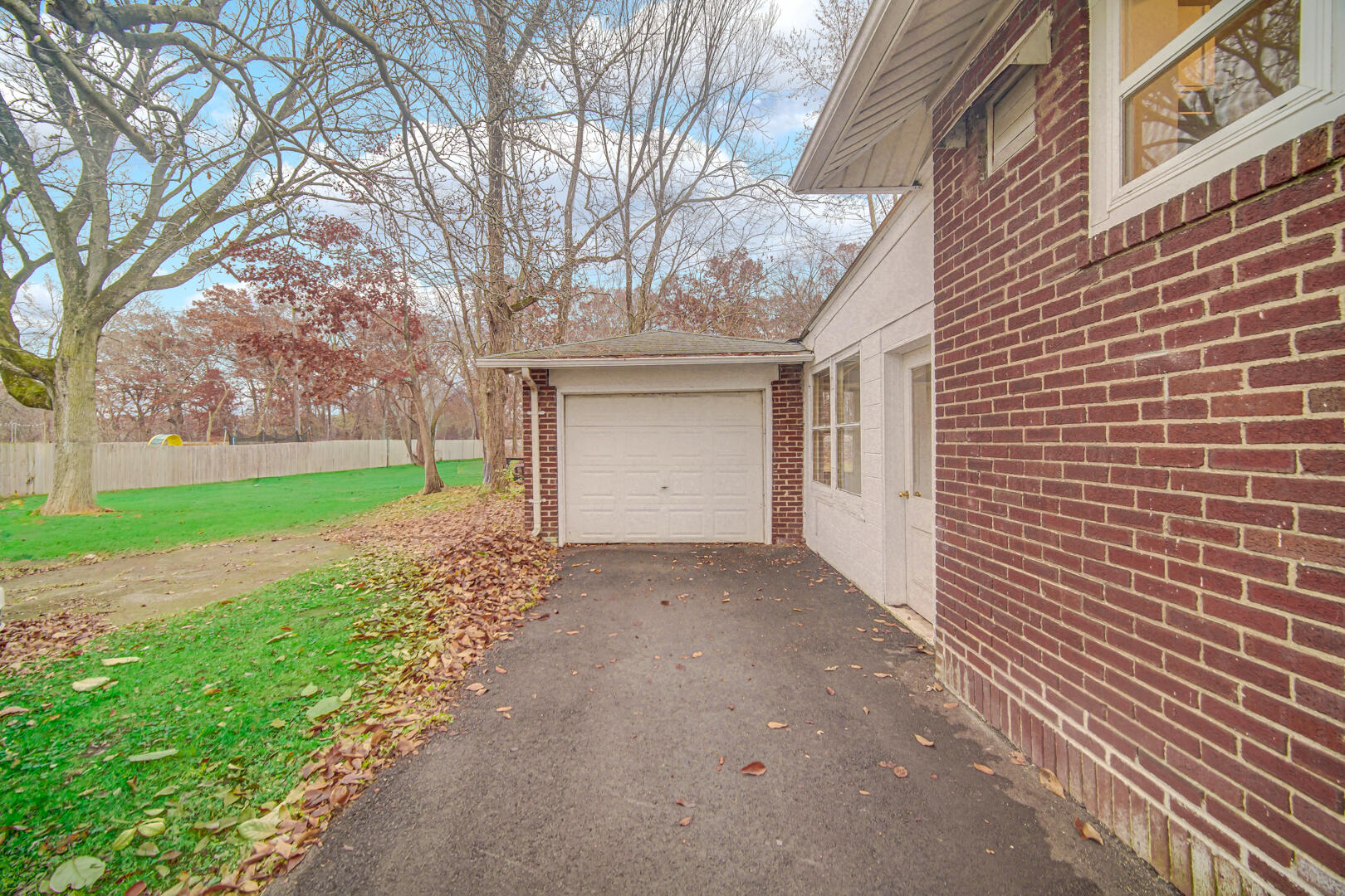 523 West 3rd Street Hobart, IN 46342 - Photo 15 of 17 a view of a house with a yard and garage