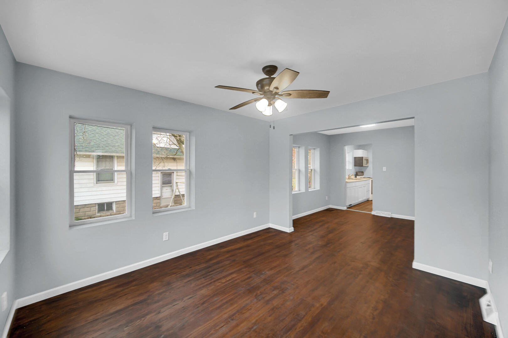 523 West 3rd Street Hobart, IN 46342 - Photo 3 of 17 a view of empty room with wooden floor and fan