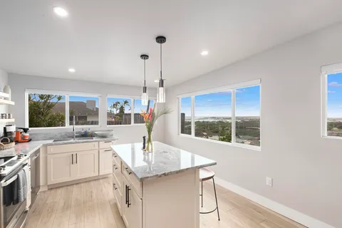 a bathroom with a double vanity sink mirror double and shower