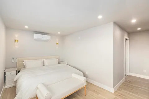 a bathroom with a sink mirror and vanity