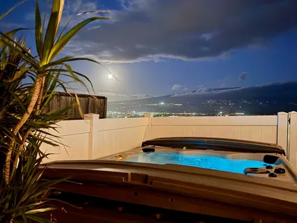 a view of swimming pool with outdoor seating and yard in the back