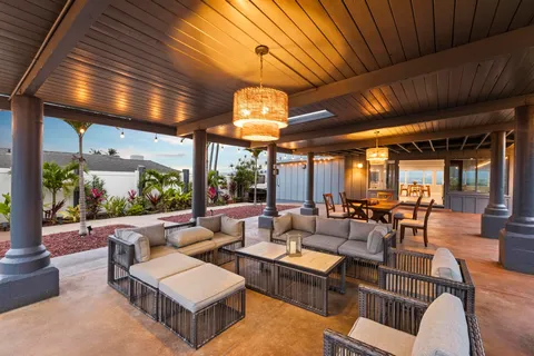 a view of a chairs and table in patio
