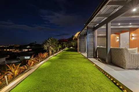 a kitchen with a sink and a stove top oven