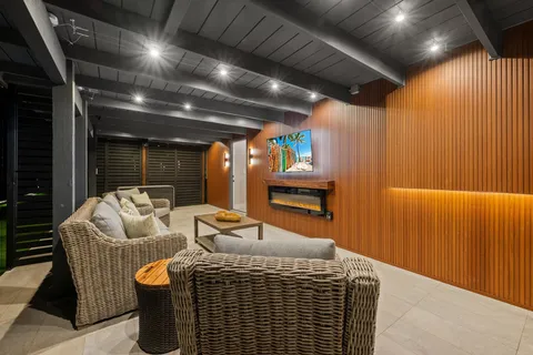 a bathroom with a granite countertop sink toilet a mirror and shower