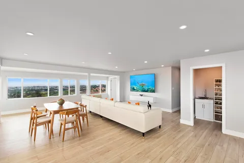 a kitchen with stainless steel appliances kitchen island granite countertop a sink and cabinets