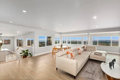 a kitchen with stainless steel appliances granite countertop sink microwave and wooden floor