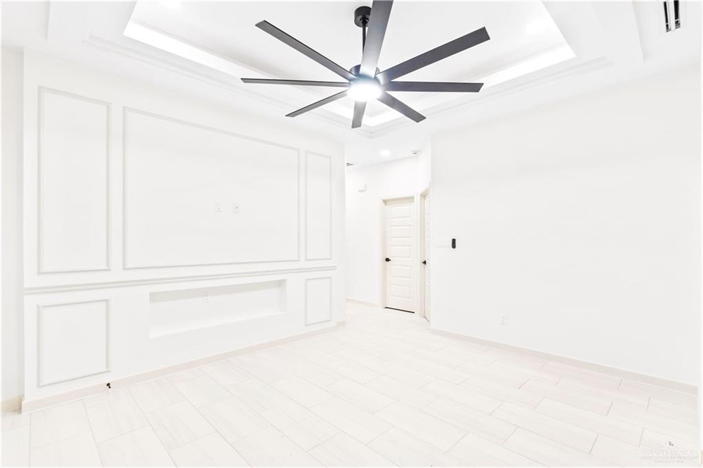 6801 South Azul Lane Pharr, TX 78577 - Photo 3 of 19 an empty room with closet and ceiling fan