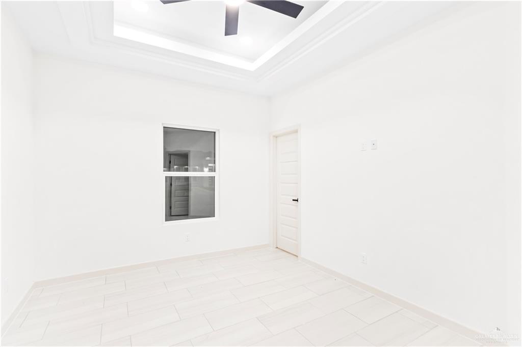 6801 South Azul Lane Pharr, TX 78577 - Photo 7 of 19 a view of an empty room with a window