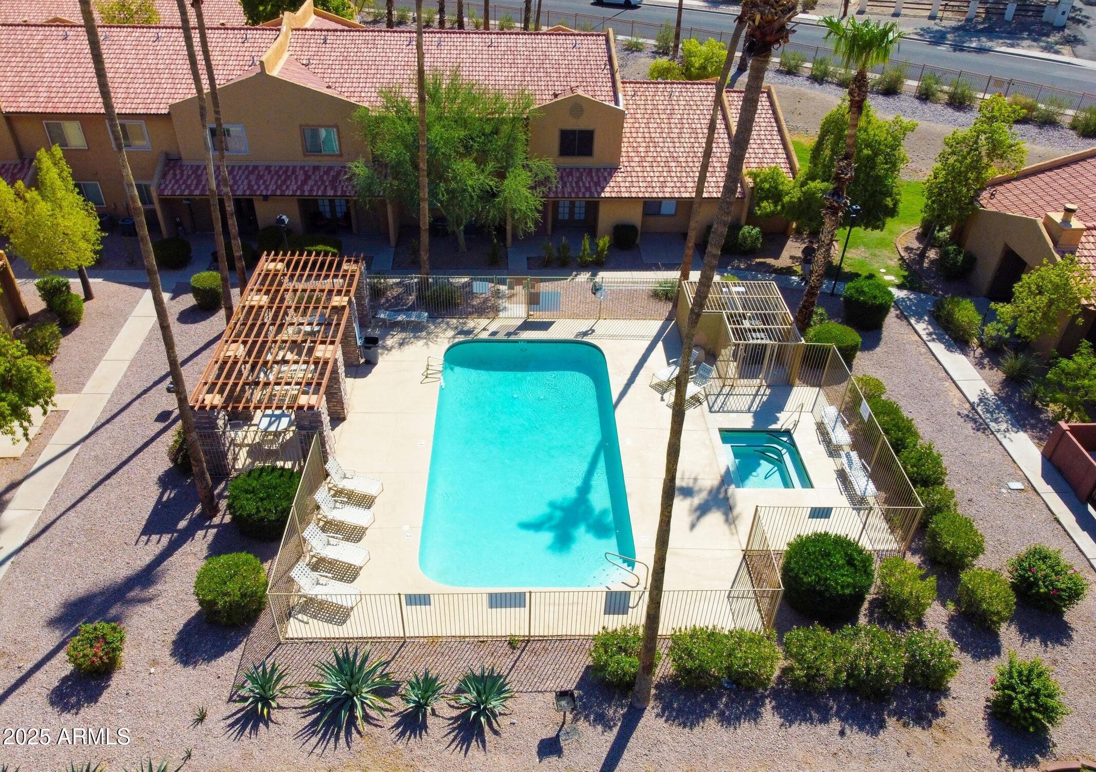 3511 East Baseline Road, Unit 1259 Phoenix, AZ 85042 - Photo 11 of 14 an aerial view of a swimming pool with outdoor seating