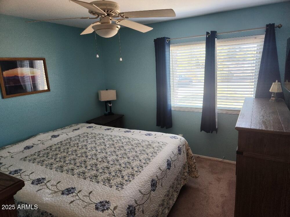 3511 East Baseline Road, Unit 1259 Phoenix, AZ 85042 - Photo 6 of 14 a bedroom with a bed and a window