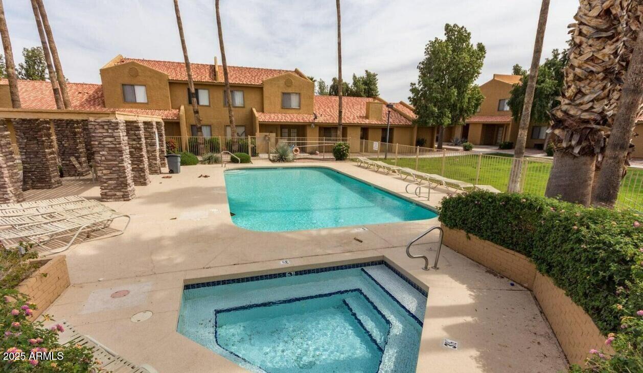 3511 East Baseline Road, Unit 1259 Phoenix, AZ 85042 - Photo 9 of 14 a view of a swimming pool with a lake view