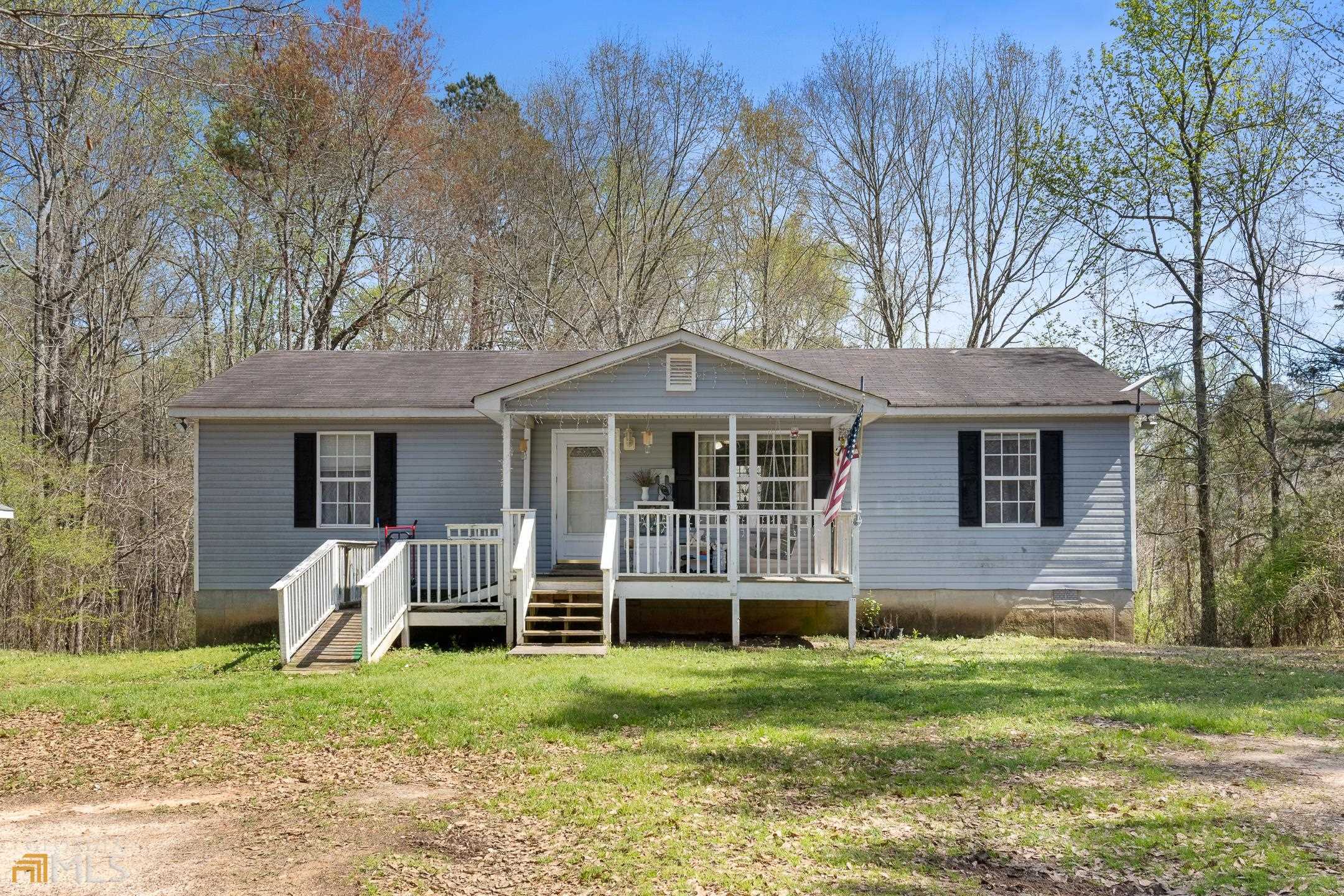 279 Ridgeway Road Milner, GA 30257 - Photo 1 of 1 a front view of a house with garden