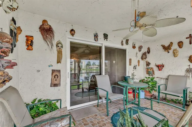 a living room with furniture and flowers