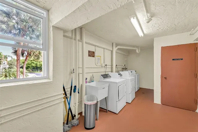 a spacious bathroom with a double vanity sink a mirror and a bathtub